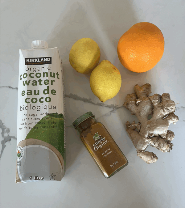 organic Coconut water carton, a fresh orange unpeeled, 2 lemons unpeeled, ginger root, turmeric organic powder